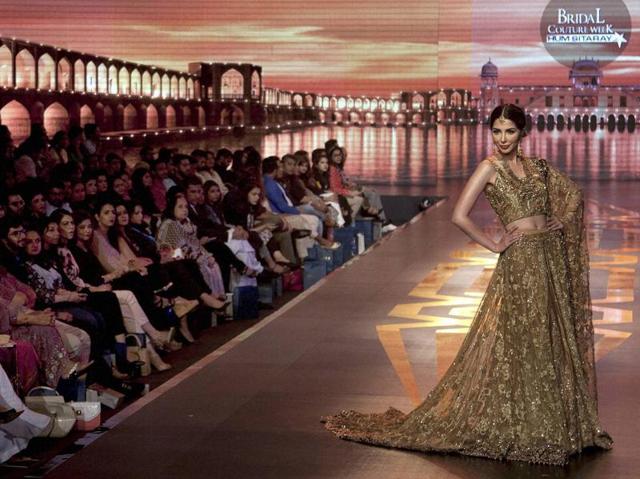 A model presents a creation by Pakistani designer Uzma Baber. Day one of the bridal wear extravaganza showcased dazzling collections by high-end designers namely, Fahad Hussayn, Yasmin Zaman, Erum Khan, Mohsin Naveed Ranjha, Tabbasum Mughal, Naushad Imdad, Mansoor Akram and Saadia Mirza. (AP) A model presents a creation by Pakistani designer Uzma Baber. Day one of the bridal wear extravaganza showcased dazzling collections by high-end designers namely, Fahad Hussayn, Yasmin Zaman, Erum Khan, Mohsin Naveed Ranjha, Tabbasum Mughal, Naushad Imdad, Mansoor Akram and Saadia Mirza. (AP)