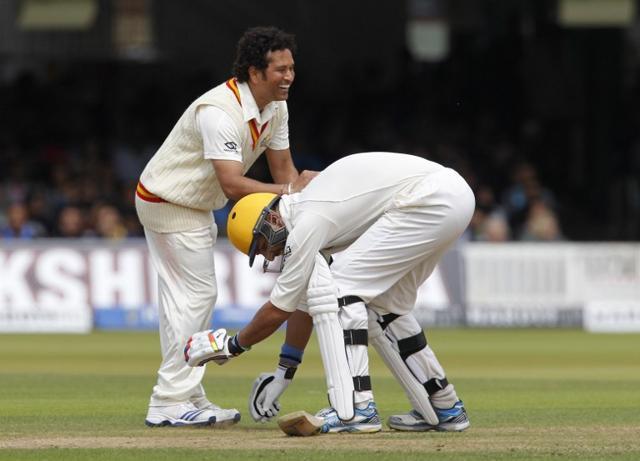 Yuvraj Singh playing for the Rest of the World team falls on Sachin Tendulkar’s feet after he bowls an over to him during the Lord's bicentenary match between the MCC and Rest of the world at Lords Cricket ground in London on July 5, 2014. (AFP) Yuvraj Singh playing for the Rest of the World team falls on Sachin Tendulkar’s feet after he bowls an over to him during the Lord's bicentenary match between the MCC and Rest of the world at Lords Cricket ground in London on July 5, 2014. (AFP)