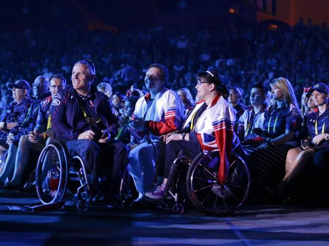 Athletes and their families watch a musical performance. (AP) Athletes and their families watch a musical performance. (AP)