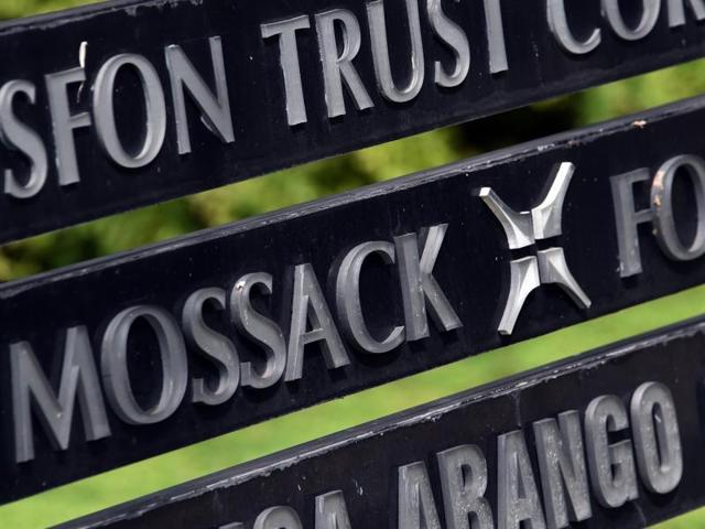 A security guard sits outside the the Mossack Fonseca law firm in Panama City. The company actively promoted New Zealand as a good place to do business due to its tax-free status, high levels of confidentiality and legal security. (AP) A security guard sits outside the the Mossack Fonseca law firm in Panama City. The company actively promoted New Zealand as a good place to do business due to its tax-free status, high levels of confidentiality and legal security. (AP)