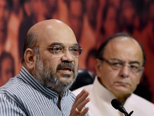 BJP president Amit Shah and finance minister Arun Jaitley during a press conference at the BJP headquarters in New Delhi on Monday.(PTI)