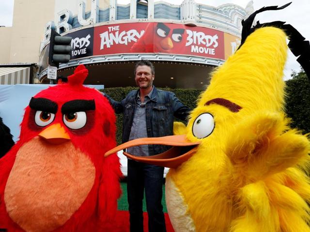 Cast member Blake Shelton poses with characters from the movie at the party following the premiere for The Angry Birds Movie in Los Angeles. (REUTERS) Cast member Blake Shelton poses with characters from the movie at the party following the premiere for The Angry Birds Movie in Los Angeles. (REUTERS)