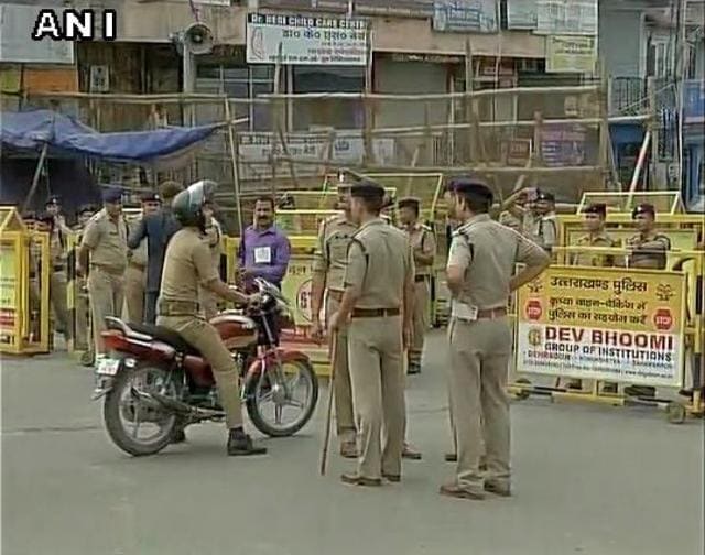 Police personnel deployed outside the state assembly in Dehradun ahead of trust vote in House. (ANI Photo) Police personnel deployed outside the state assembly in Dehradun ahead of trust vote in House. (ANI Photo)