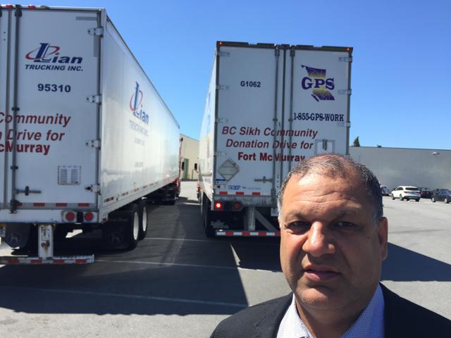Tony Singh outside his godown before three trucks were dispatched to Fort McMurray. (HT Photo)