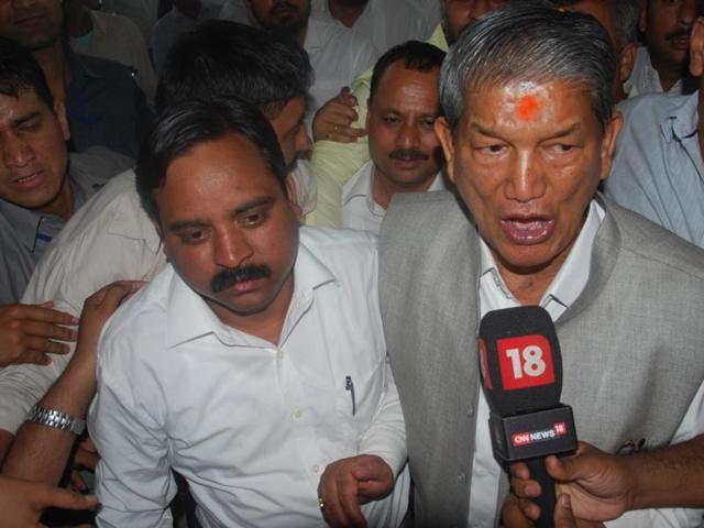 Former Chief Minister Harish Rawat and Congress MLAs talking to the media after the floor test in the Uttarakhand Assembly, in Dehradun on Tuesday.(PTI)