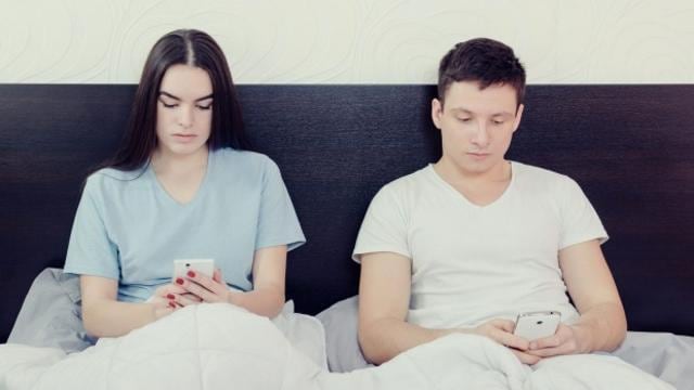 Doctors from leading psychiatry institutes say smartphone addiction is hampering the married life of newly-wed couples in India and reducing sexual intimacy among partners as early as a month after marriage. (Shutterstock) Doctors from leading psychiatry institutes say smartphone addiction is hampering the married life of newly-wed couples in India and reducing sexual intimacy among partners as early as a month after marriage. (Shutterstock)