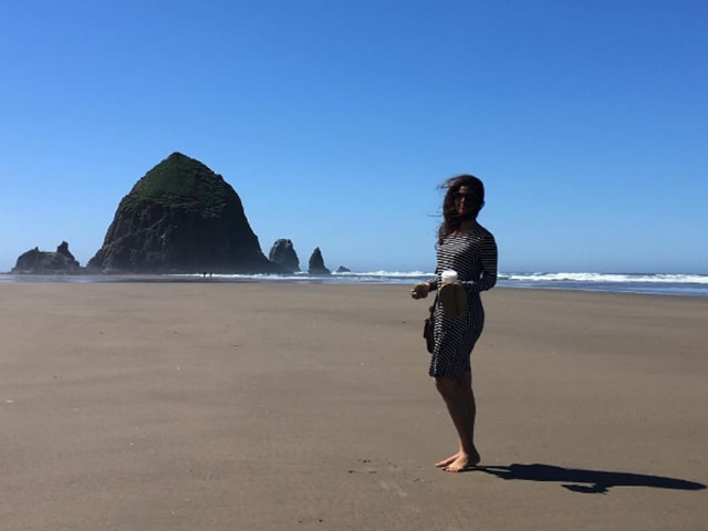 Nimrat poses barefoot near the ocean. Can we join her already? 