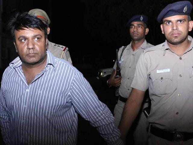 Vinod Verma in police custody. (HT Photo) Vinod Verma in police custody. (HT Photo)