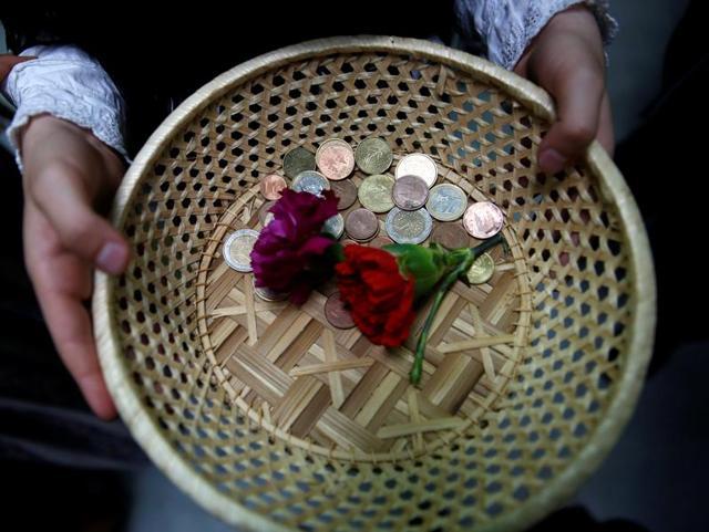Las Mayas festival is held annually at the beginning of May to celebrate the awakening of nature in Spring. Maya assistant girls offer carnations in exchange for coins during the festivity. (REUTERS)