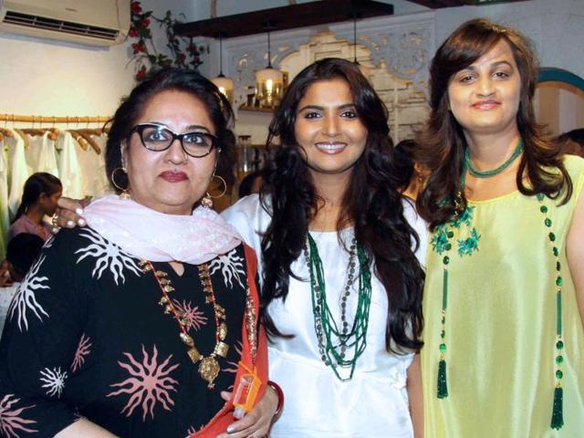 Store owners Jyoti Mukhejee(C)and Bhumika (R) strike pose with Bolywood actor Reena Roy at the store launch. (AFP) Store owners Jyoti Mukhejee(C)and Bhumika (R) strike pose with Bolywood actor Reena Roy at the store launch. (AFP)
