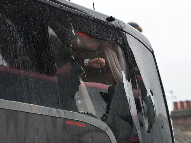 A drink can flies through the air before hitting the Manchester United team bus as it arrives for the English Premier League match against West Ham United. (AP) A drink can flies through the air before hitting the Manchester United team bus as it arrives for the English Premier League match against West Ham United. (AP)