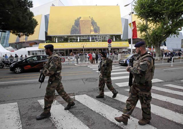 French soldiers patrol in front of the Festival Palace before the opening ceremony. (REUTERS) French soldiers patrol in front of the Festival Palace before the opening ceremony. (REUTERS)