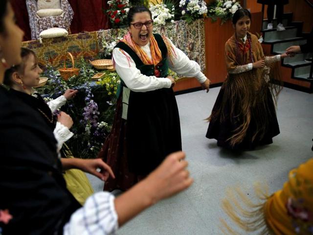 Las Mayas tradition is said to have its origins in a pagan ritual dating back to the Roman times, when the earth goddess Maia was worshipped to welcome the arrival of the Spring. Maya girls and their assistants are led in a dance by a woman during the festival. (REUTERS)