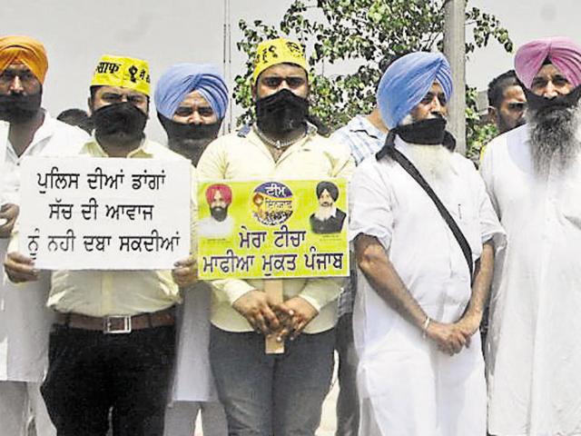 Supporters of MLA Simarjit Singh Bains during a protest in Ludhiana on Wednesday.(Sikander Singh Chopra/HT Photo)