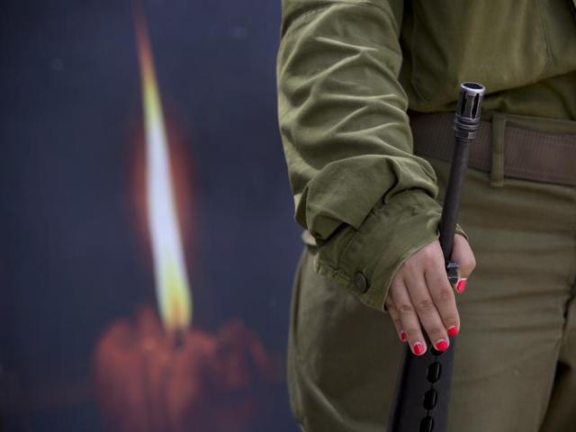 An Israeli soldier takes part in a rehearsal for a ceremony to mark Israel's Memorial Day for fallen soldiers. (AP)