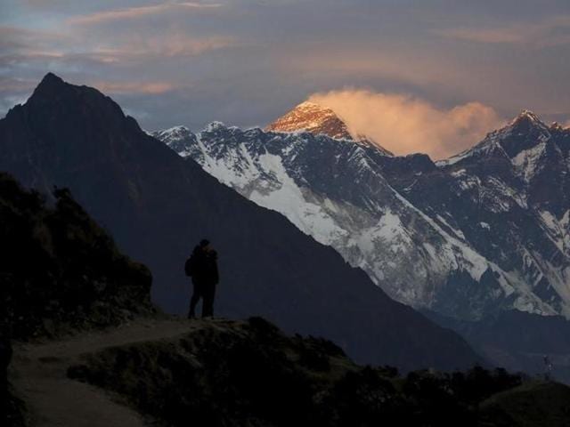 A trekker stands in front of Mount Everest on May 7, 2014. (Reuters File) A trekker stands in front of Mount Everest on May 7, 2014. (Reuters File)