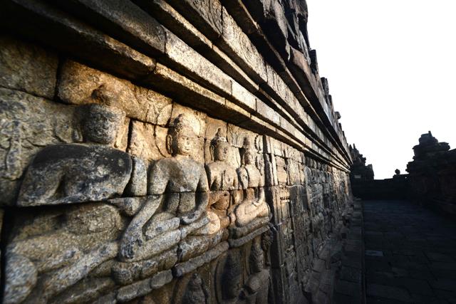 72 Buddha statues surround the central dome with each statue seated inside a perforated stupa. Borobudur is the world’s largest Buddhist temple. (AFP) 