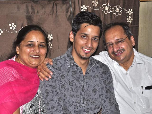 Ayush Garg with his parents at his residence in Ludhiana on Wednesday.(Sikander Singh Chopra/HT Photo)
