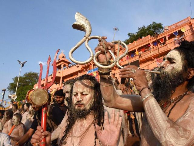 Naga Sadhu and devotees take part in the holy dip on the second Shahi Snan in Kshipra River during Simhastha Maha Kumbh Mela in Ujjain. (PTI) 