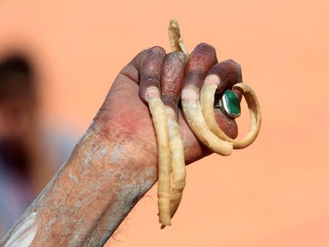 A hand of a Sadhu seen after taking a dip in the waters of Shipra river during the second 'Shahi Snan' (grand bath) at Simhastha Kumbh Mela in Ujjain. (REUTERS) 