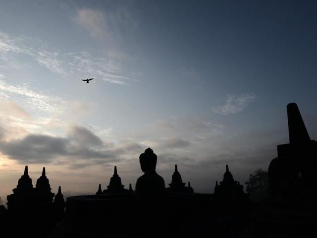 For centuries, Borobudur lay hidden under layers of volcanic ash until restoration programme undertaken between 1973 and 1984 returned much of the complex to its former glory, and the site has since become a destination of Buddhist pilgrimage.  (AFP) 