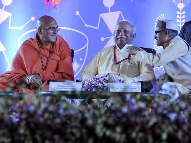 RSS chief Mohan Bhagwat, Juna Akhada head Swami Avadeshanand, Gayatri Parivar head Pranav Pandya and chief minister Shivraj Singh Chouhan at Ninora Village in Ujjain on Thursday. (Arun Mondhe/HT photo) RSS chief Mohan Bhagwat, Juna Akhada head Swami Avadeshanand, Gayatri Parivar head Pranav Pandya and chief minister Shivraj Singh Chouhan at Ninora Village in Ujjain on Thursday. (Arun Mondhe/HT photo)