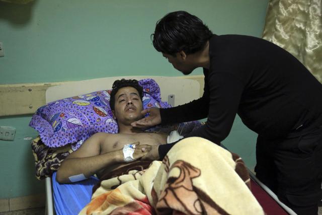 Raad Hadi comforts his brother Saad, a victim of bombing attacks as he receives treatment at a Hospital in Sadr City, Baghdad. In the deadliest violence in Baghdad this year, three car bombs killed and wounded dozens of civilians across the Iraqi capital Wednesday. (AP) Raad Hadi comforts his brother Saad, a victim of bombing attacks as he receives treatment at a Hospital in Sadr City, Baghdad. In the deadliest violence in Baghdad this year, three car bombs killed and wounded dozens of civilians across the Iraqi capital Wednesday. (AP)