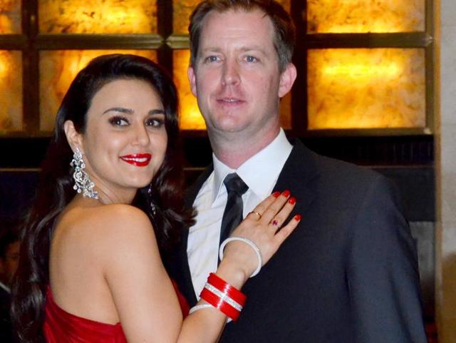 Preity looked beautiful in a red gown while Gene kept it understated in a suit. (Yogen Shah/HT PHOTO) 