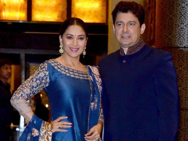 Madhuri Dixit with husband Sriram Nene at the wedding reception. (Yogen Shah/HT PHOTO) 