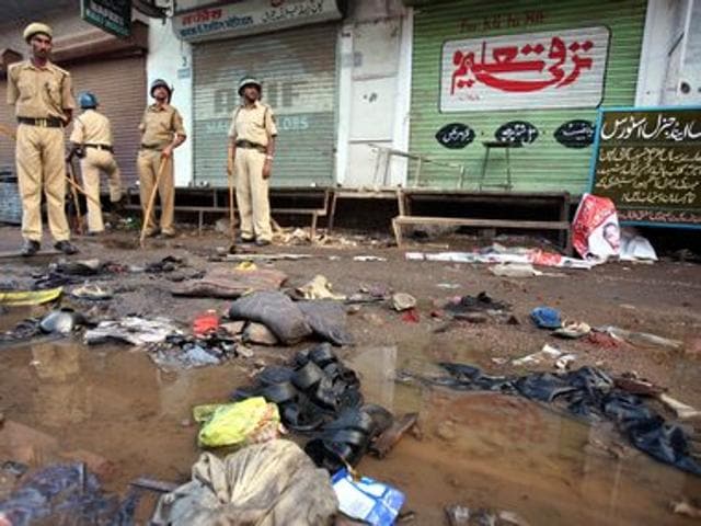 Police officials stand guard at a blast site outside a mosque in Malegaon, on 9 September, 2006. Reuters Police officials stand guard at a blast site outside a mosque in Malegaon, on 9 September, 2006. Reuters
