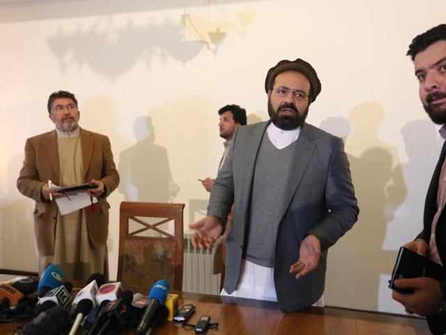 Amin Karim, second right, an official of the Hezb-i-Islami Party, speaks as he leaves after a press conference in Kabul, Afghanistan. An Afghan official says the government will finalize a peace deal with a notorious militant insurgent group within days.(AP) Amin Karim, second right, an official of the Hezb-i-Islami Party, speaks as he leaves after a press conference in Kabul, Afghanistan. An Afghan official says the government will finalize a peace deal with a notorious militant insurgent group within days.(AP)