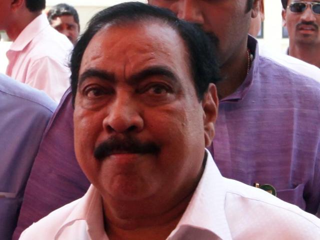 After the arrest of a man claiming to be his personal assistant, Maharashtra revenue minister Eknath Khadse has distanced himself from the controversy. (HT file photo) After the arrest of a man claiming to be his personal assistant, Maharashtra revenue minister Eknath Khadse has distanced himself from the controversy. (HT file photo)