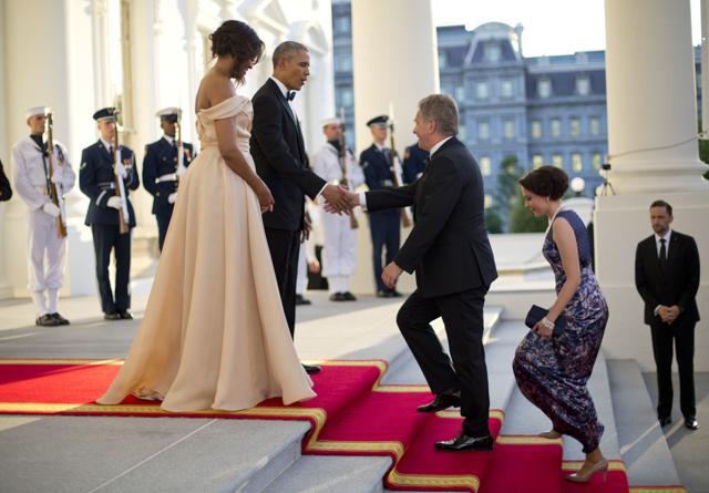 President Barack Obama and first lady Michelle Obama greet Finnish President Sauli Niinisto and his wife Jenni Haukio on the North Portico. (AP Photo)