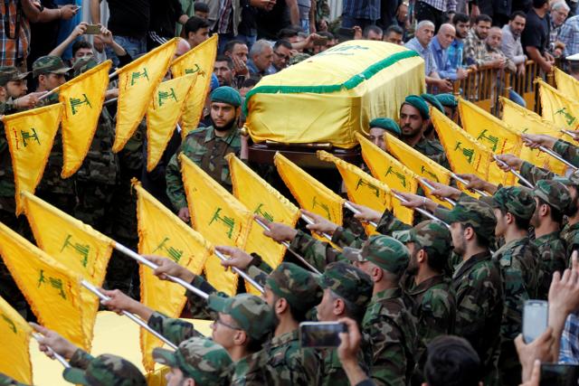 Hezbollah members carry the coffin of Mustafa Badreddine during his funeral in Beirut's southern suburbs. (REUTERS) Hezbollah members carry the coffin of Mustafa Badreddine during his funeral in Beirut's southern suburbs. (REUTERS)