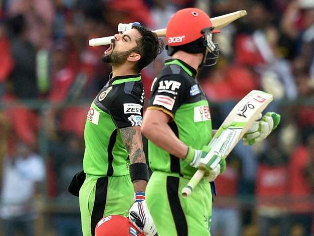 Virat Kohli celebrates his hundred as AB de Villiers watches. (PTI) Virat Kohli celebrates his hundred as AB de Villiers watches. (PTI)