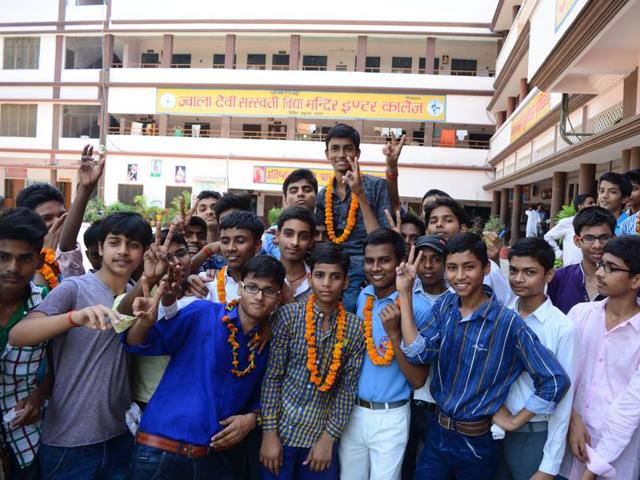 Students in Allahabad carry one of their colleagues on their shoulders to celebrate their results. (Sheeraz Rizvi/HT photo)
