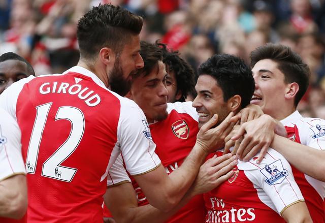 Mikel Arteta celebrates with team mates after Aston Villa's Mark Bunn scored an own goal. (Reuters Photo) Mikel Arteta celebrates with team mates after Aston Villa's Mark Bunn scored an own goal. (Reuters Photo)