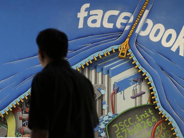 In this file photo, a man walks past a mural in an office on the Facebook campus in Menlo Park, California. (AP) In this file photo, a man walks past a mural in an office on the Facebook campus in Menlo Park, California. (AP)