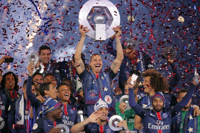 PSG's Zlatan Ibrahimovic celebrates with teammates on the podium after winning the French League one title. (AP Photo)