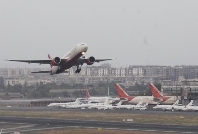 An Air India plane takes off from Mumbai Airport. An elderly woman passenger on wheel chair was not allowed to board her AI flight to New York from Mumbai via Delhi allegedly due to “over booking.”(HT File Photo)