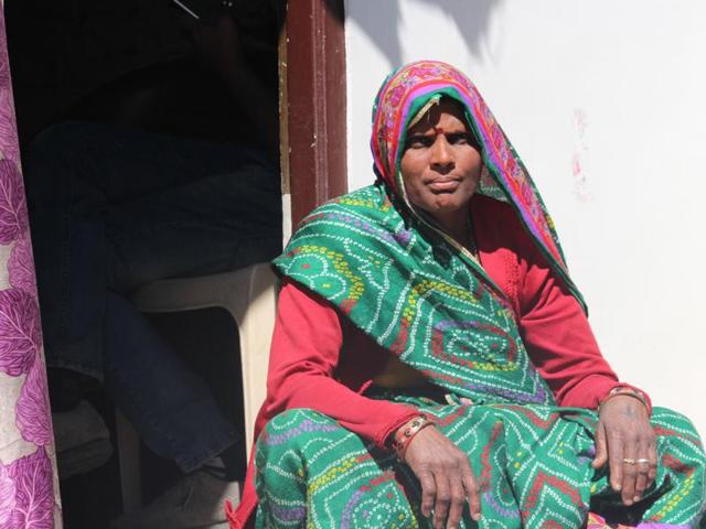 Dev Kor outside her house in a slum of Indore. (HT photo)