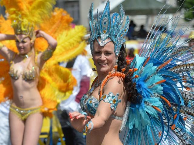 The festival ends with a colourful street parade with music and dance on Pentecost Sunday. A costumed dancer performs during the carnival. (AFP) The festival ends with a colourful street parade with music and dance on Pentecost Sunday. A costumed dancer performs during the carnival. (AFP)