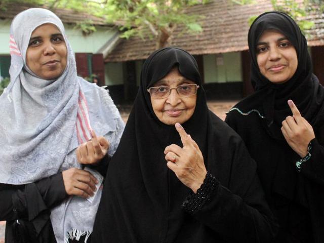 Muslim women show their inked fingers after casting their votes at a polling booth in Kozhikode. (PTI File Photo) Muslim women show their inked fingers after casting their votes at a polling booth in Kozhikode. (PTI File Photo)