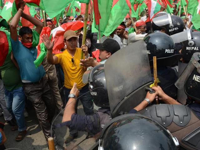 Nepalese activists from the Federal Alliance (members of the Madhesi and ethnic communities) scuffle with police as they try to break through a police cordon during a demonstration against the government in Kathmandu. (AFP Photo) Nepalese activists from the Federal Alliance (members of the Madhesi and ethnic communities) scuffle with police as they try to break through a police cordon during a demonstration against the government in Kathmandu. (AFP Photo)
