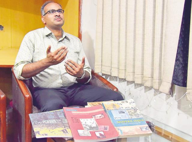 RTI activist S P Singh with NCERT textbooks. (HT Photo) RTI activist S P Singh with NCERT textbooks. (HT Photo)