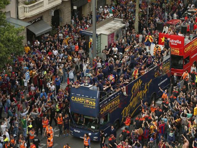 Barcelona’s players celebrate on the team bus. (AP)