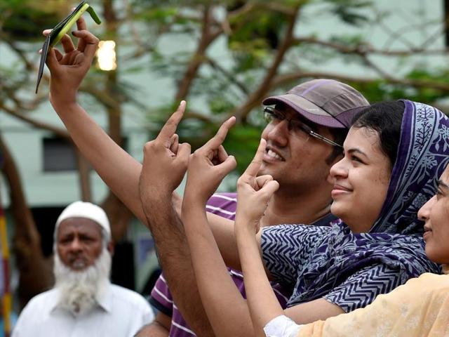 Voters take selfie after casting votes for the Tamil Nadu assembly polls in Chennai on Monday.(PTI)