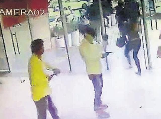 Screen grabs from the footage of the incident. Scared customers ran out the nearest exit once the firing started. Gunmen were seen kicking some of the customers as they escaped. According to the police, one person was injured when he hit a table while running out. The pub owner said a discotheque he operated earlier was also attacked in 2015 over extortion demands. (CCTV FOOTAGE) Screen grabs from the footage of the incident. Scared customers ran out the nearest exit once the firing started. Gunmen were seen kicking some of the customers as they escaped. According to the police, one person was injured when he hit a table while running out. The pub owner said a discotheque he operated earlier was also attacked in 2015 over extortion demands. (CCTV FOOTAGE)