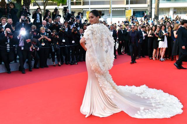 Sonam Kapoor’s gown was paired with with a floral cape that ended in a train giving her the most elegant look. (AFP) Sonam Kapoor’s gown was paired with with a floral cape that ended in a train giving her the most elegant look. (AFP)
