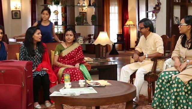 The younger girl, who represents the audience, stays in the background for the entire video. (TVF)